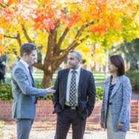 Three people talking